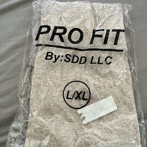 Pro Fit L/XL tan leggings basic for workout and casual. Original packaging.
